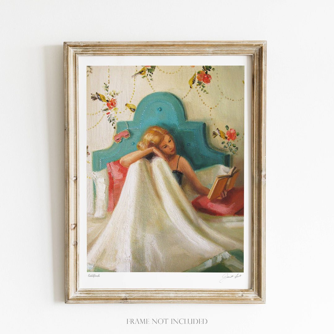 A framed art print of a goldfinch bird, with a vibrant floral background, set against a wooden frame. The image shows a bird perched on a branch with a blurred floral pattern in the background.