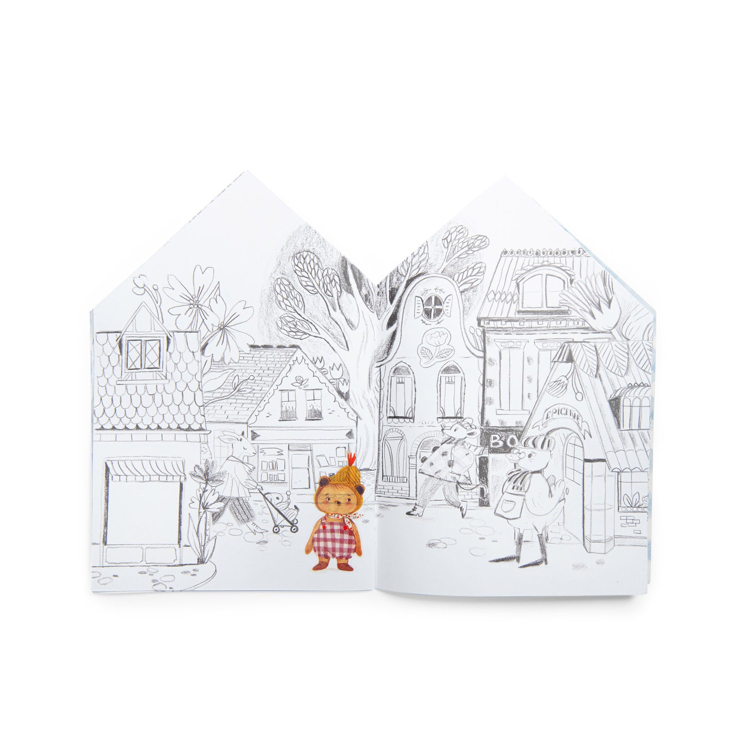 Two coloring books with illustrations of a village scene on a white background