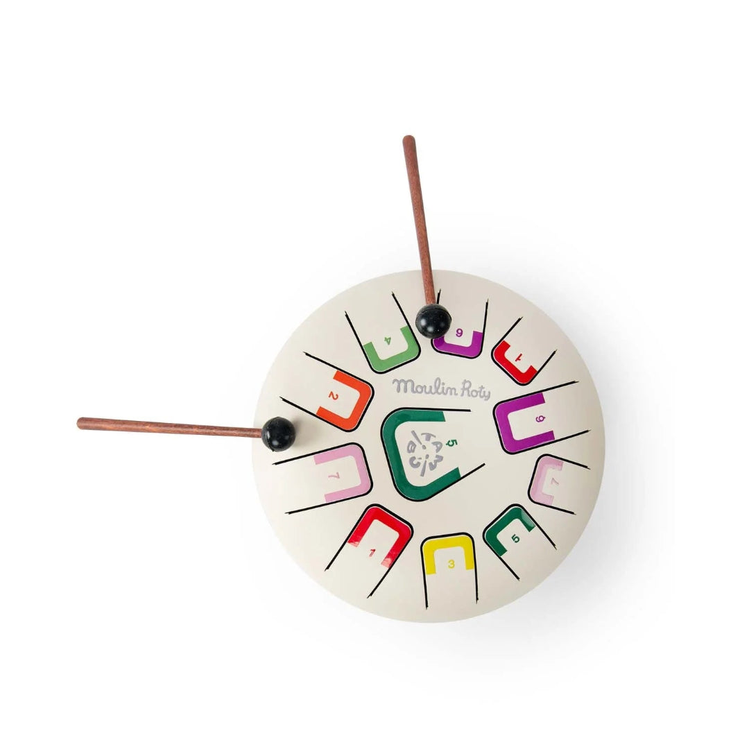 White drum toy with a white background