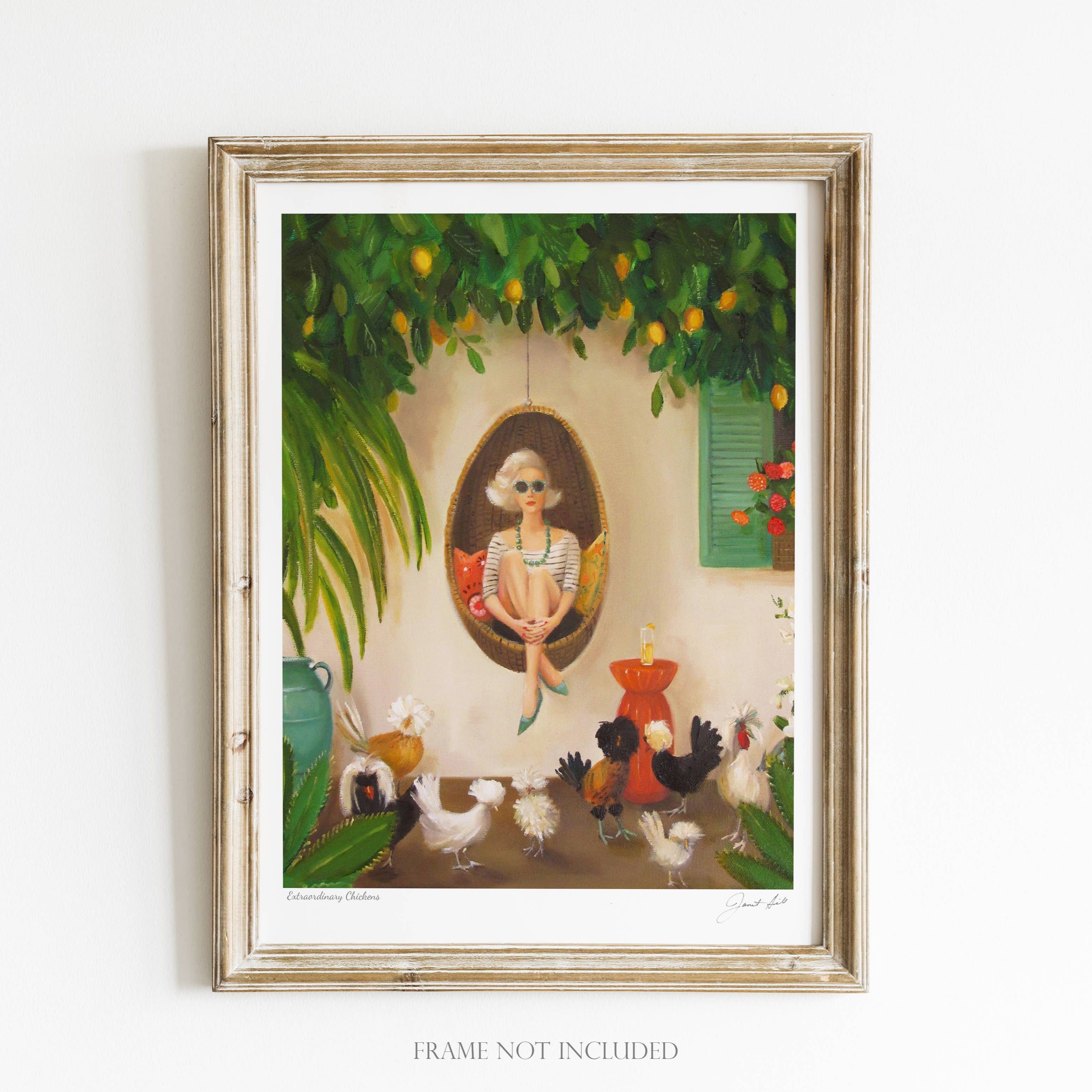 A framed art print featuring a whimsical scene with chickens, a woman sitting in a chair, and a vine-covered wall. The frame is wooden and the artwork is signed by the artist.