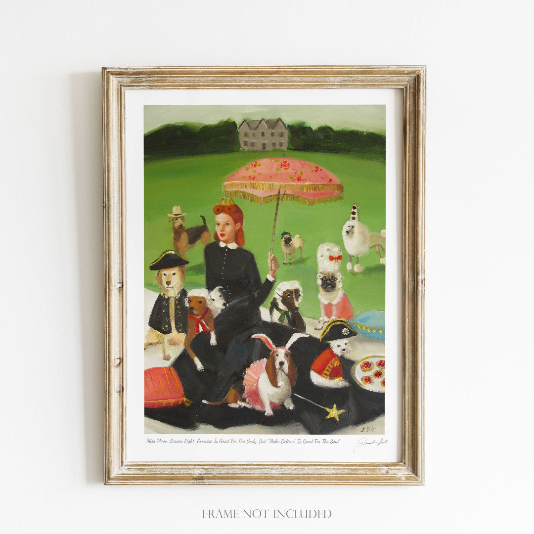 A framed art print featuring a whimsical scene with a woman, a small dog, and various animals around them, seated outdoors with a large umbrella.