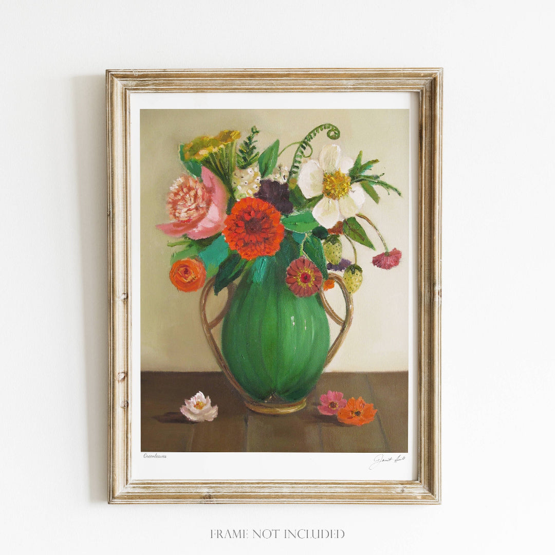 Framed artwork of a floral arrangement with a green vase on a white background