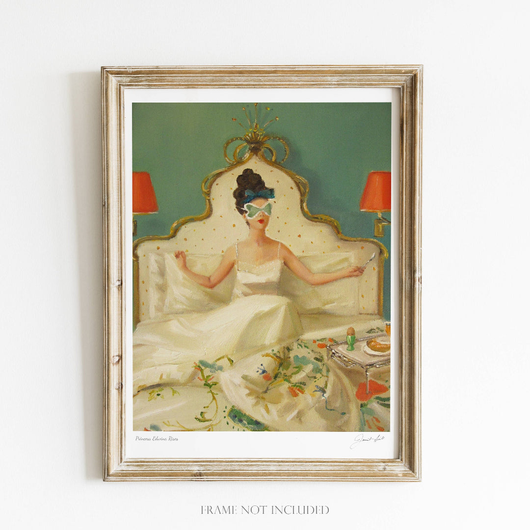 A framed art print featuring a vintage-style illustration of a woman waking up in bed with a sleeping eye mask on, surrounded by a green-painted bedroom wall and a red-patterned headboard.