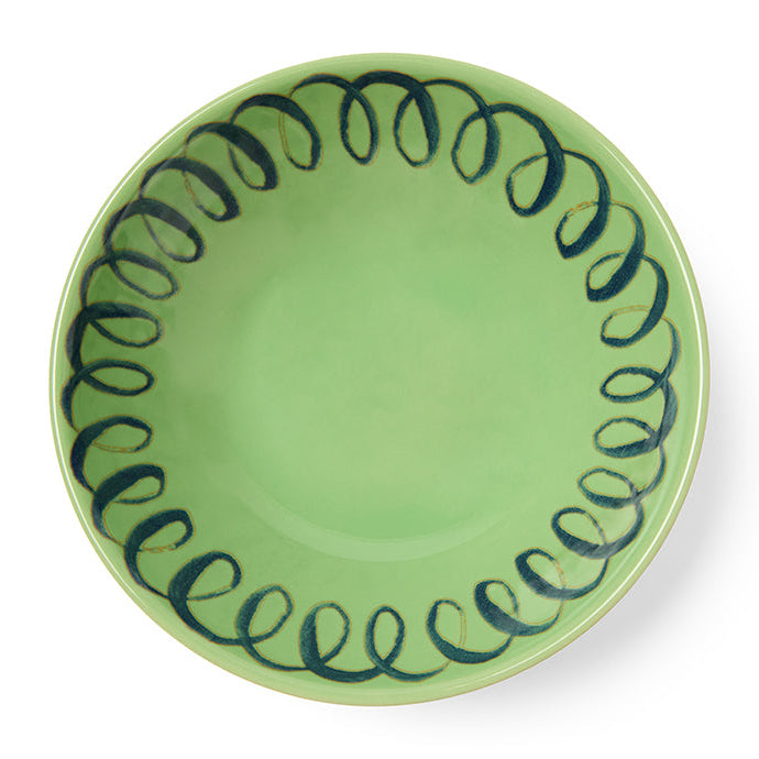 Green ceramic plate with pattern on white background