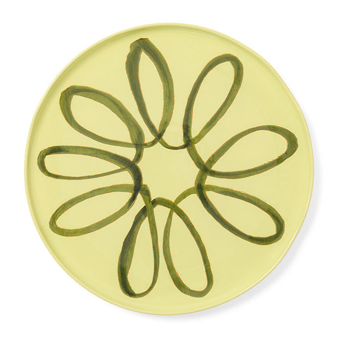 Round lime green tray with green pattern on a white background