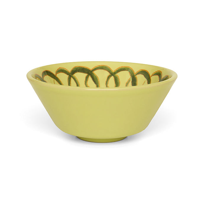 Green ceramic bowl with decorative pattern on a white background
