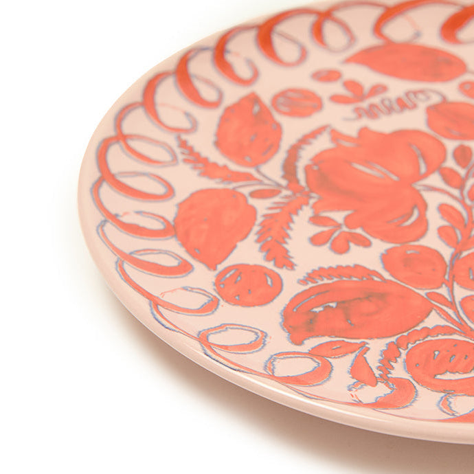 Ceramic plate with floral pattern on a white background