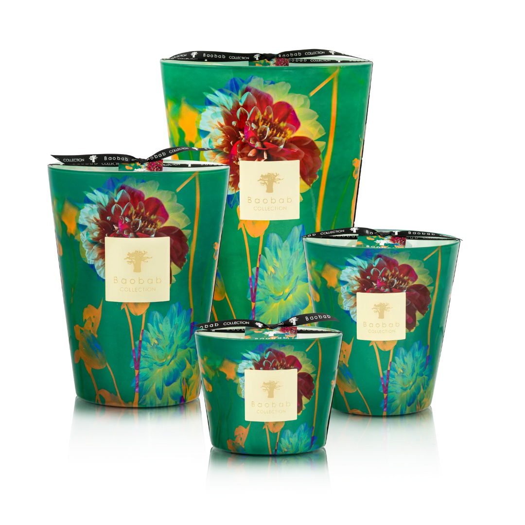 Set of four decorative candles with floral design on a white background