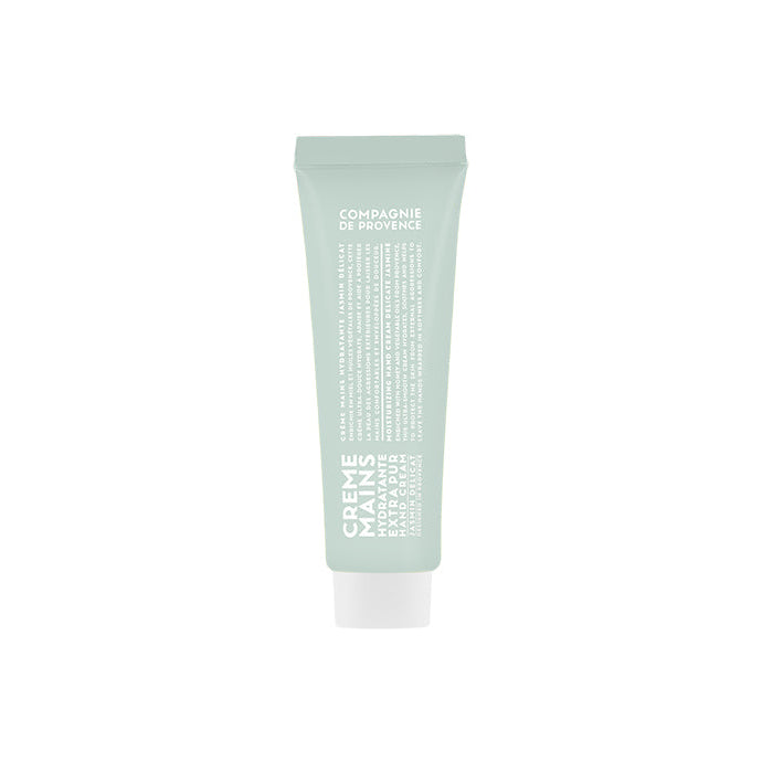 A tube of Compagnie de Provence hand cream with a soft jasmine fragrance, predominantly green in color with product details in white text.