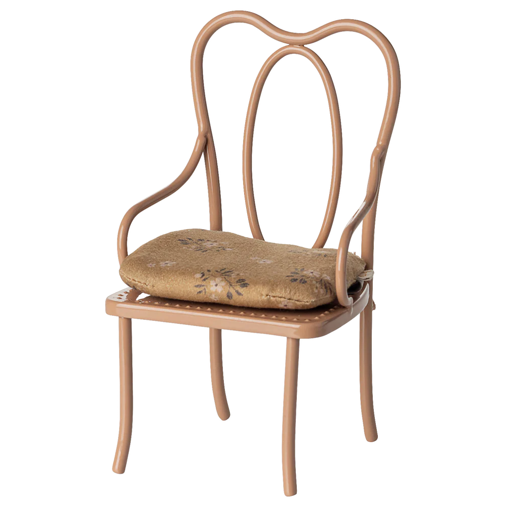 Powder chair with a cushion on a white background