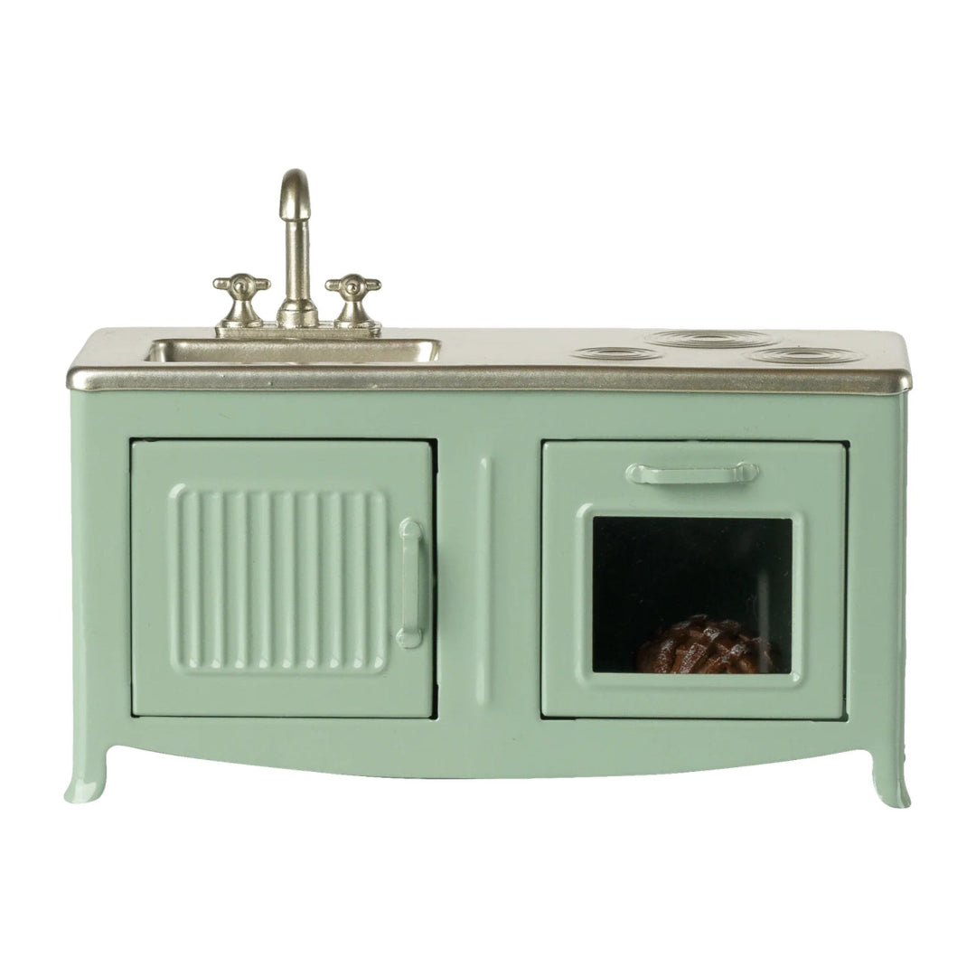 Vintage-style stove with sink and oven on a white background