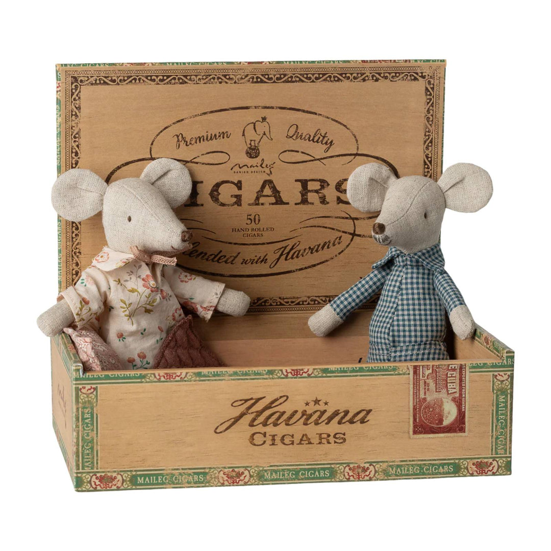 Two plush mice in a decorative Havanna Cigars box on a white background