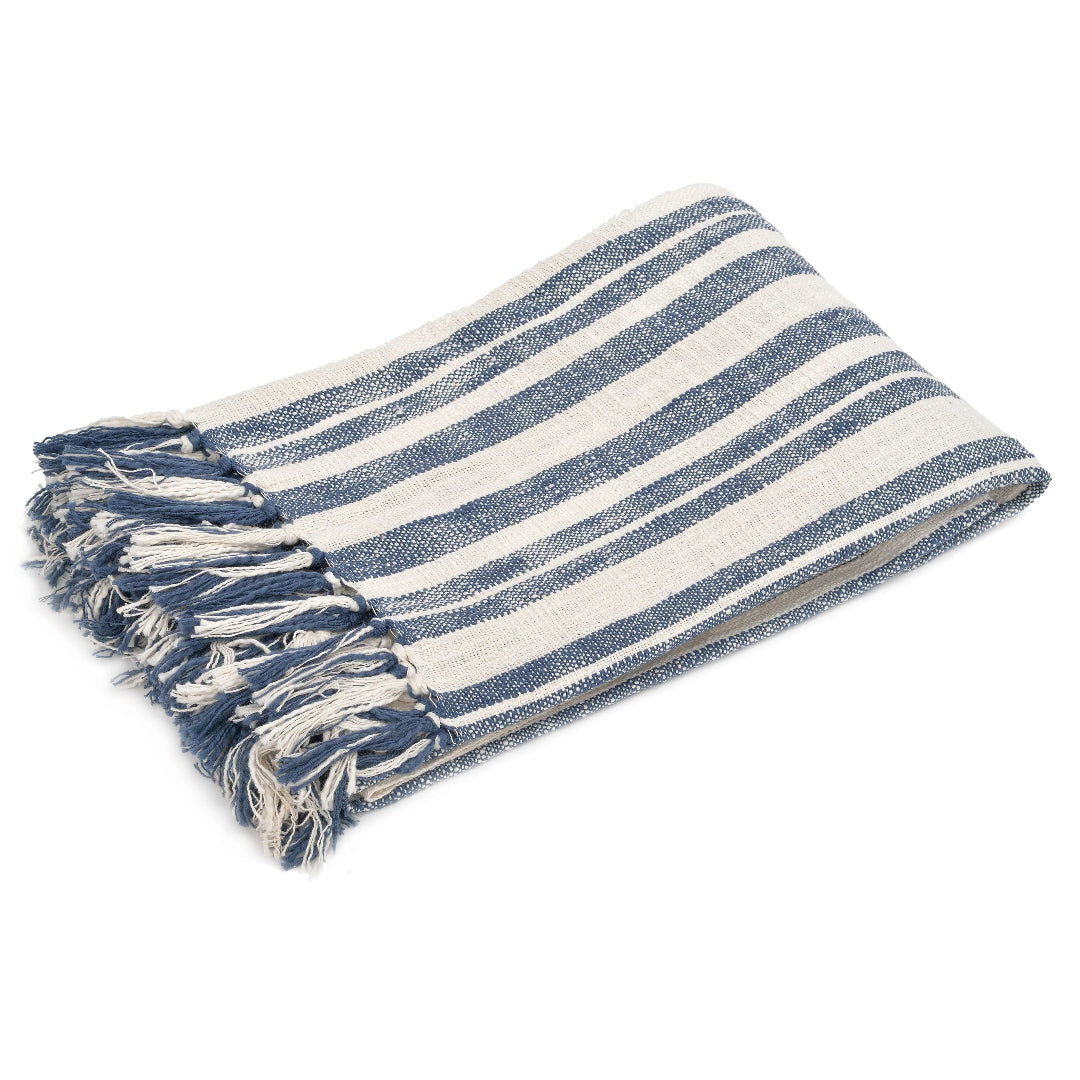 A navy and beige striped cotton throw blanket with tassels on the ends, laid out flat.