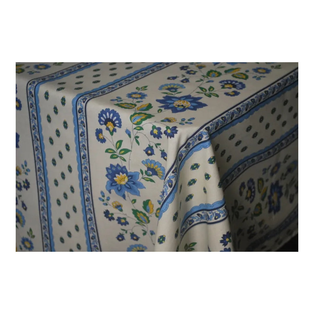 Floral patterned tablecloth with blue and green accents on a white background