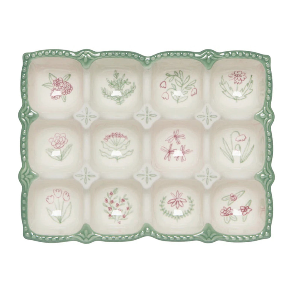 Decorative ceramic plate with floral designs on a white background