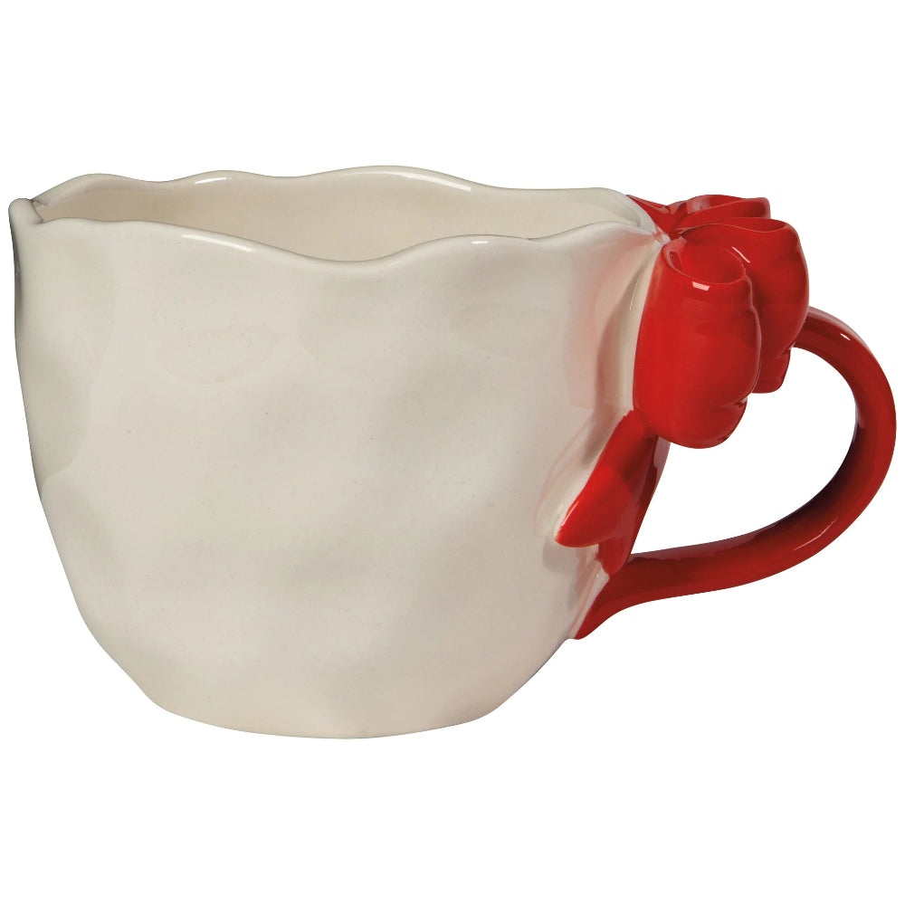 White mug with a red handle and bow on a white background