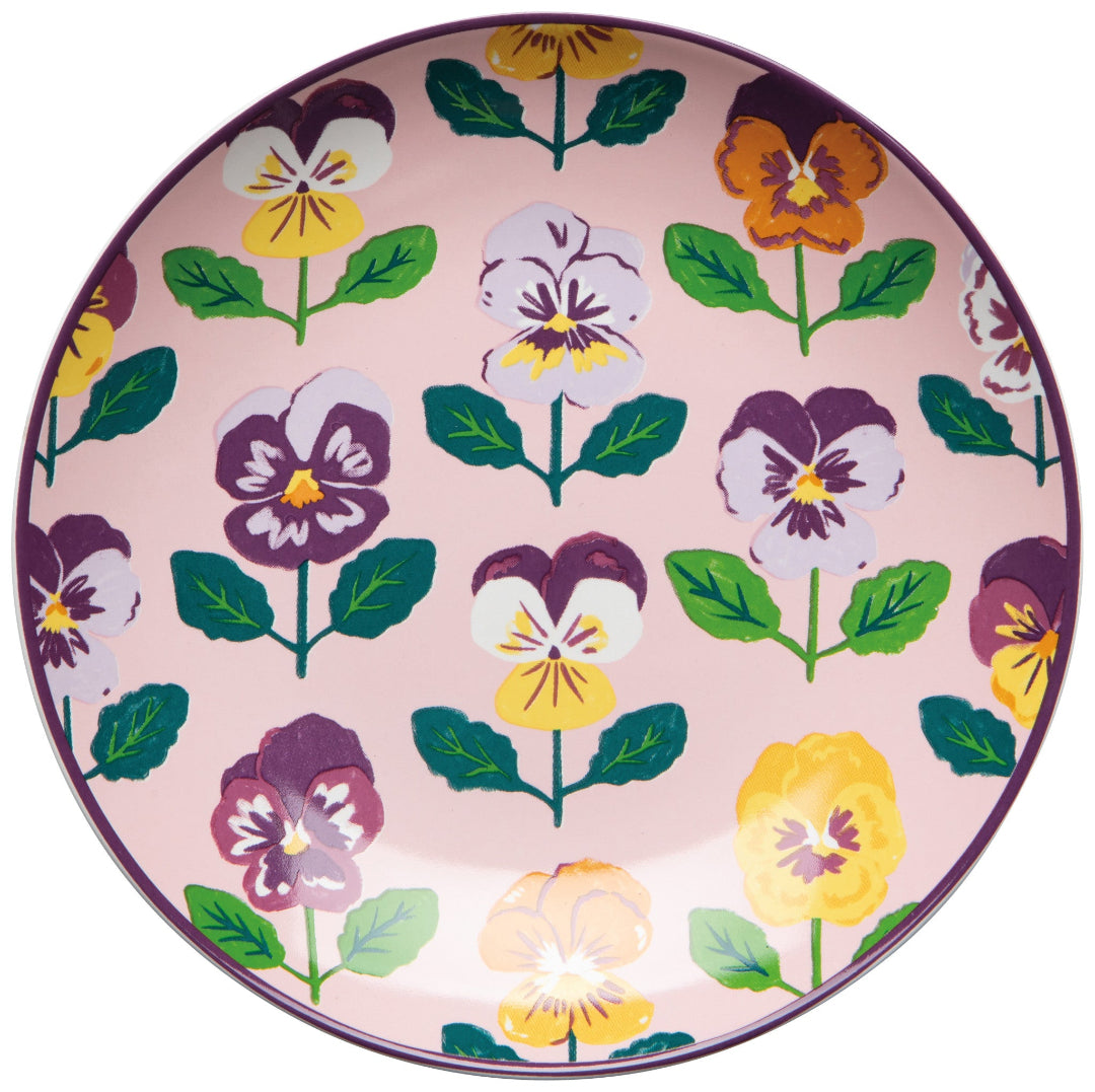 Decorative plate with floral pattern on a pink background