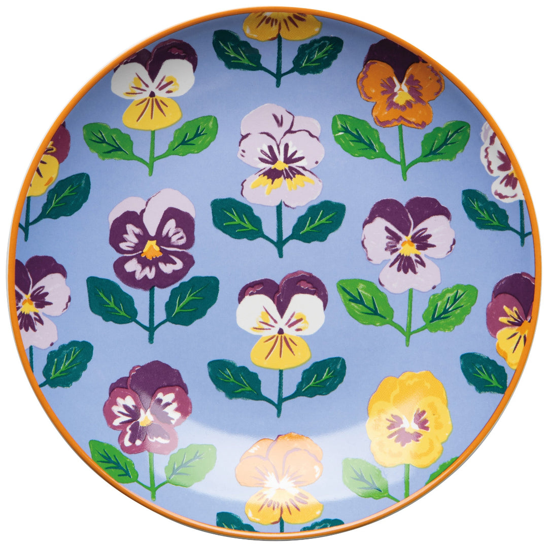Decorative plate with colorful floral pattern on a blue background