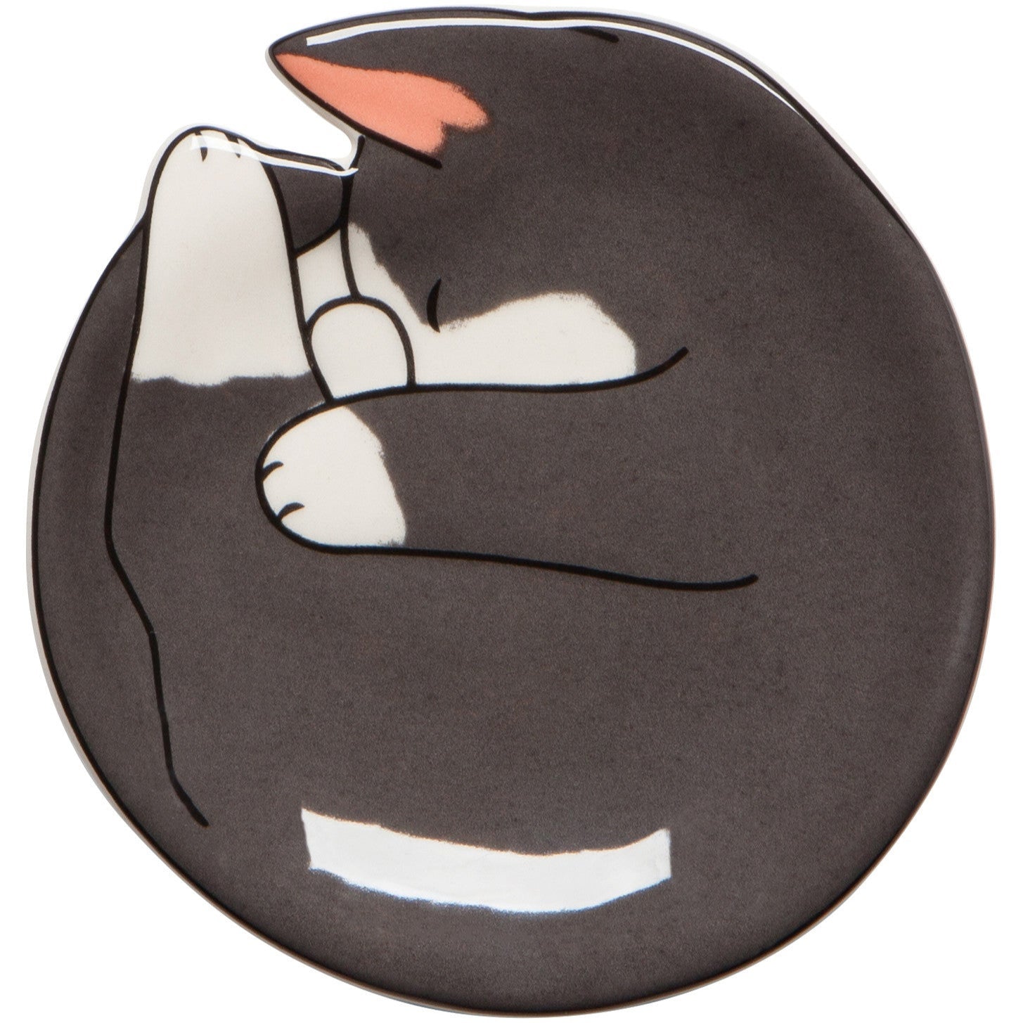 A ceramic trinket dish with a black and white cat design.