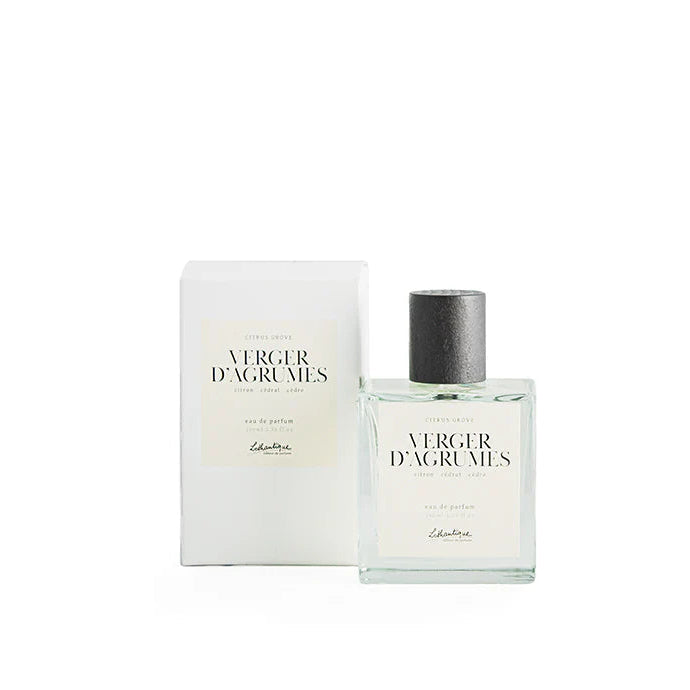 A bottle of Lothantique Eau de Parfum Citrus Grove perfume, accompanied by its packaging box, both featuring a simple white design with text and branding.