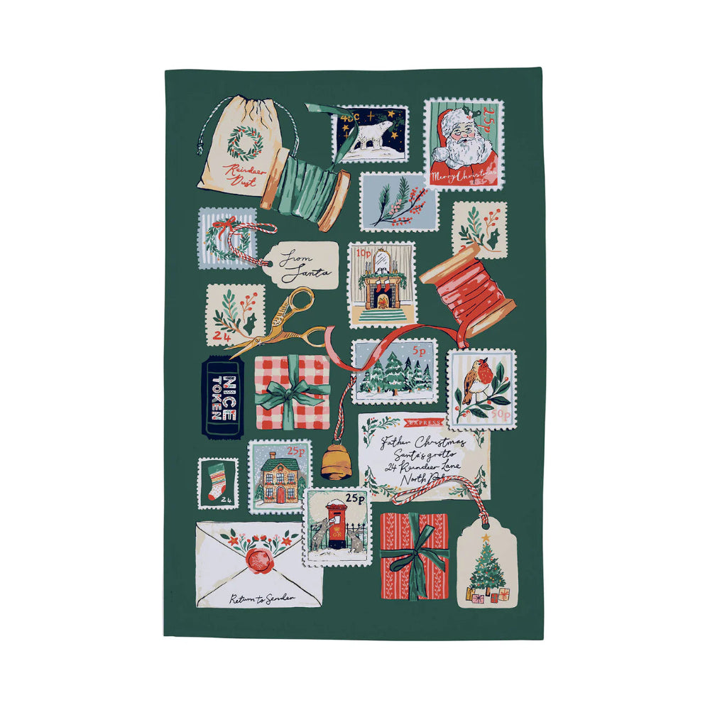 Decorative tea towel with festive designs on a green background