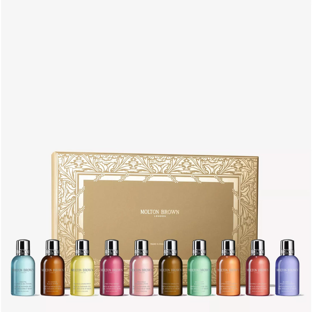 Set of Molton Brown shower gel bottles in various colors with a decorative box on a white background