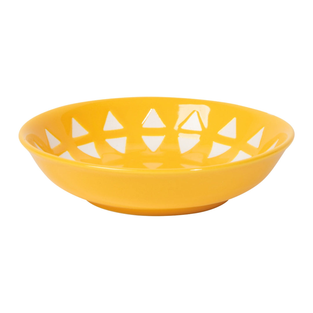 Yellow bowl with white geometric patterns on a white background