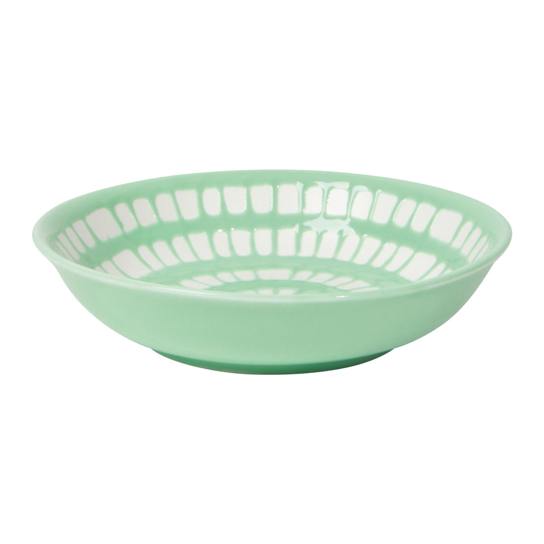 Green bowl with white interior on a white background