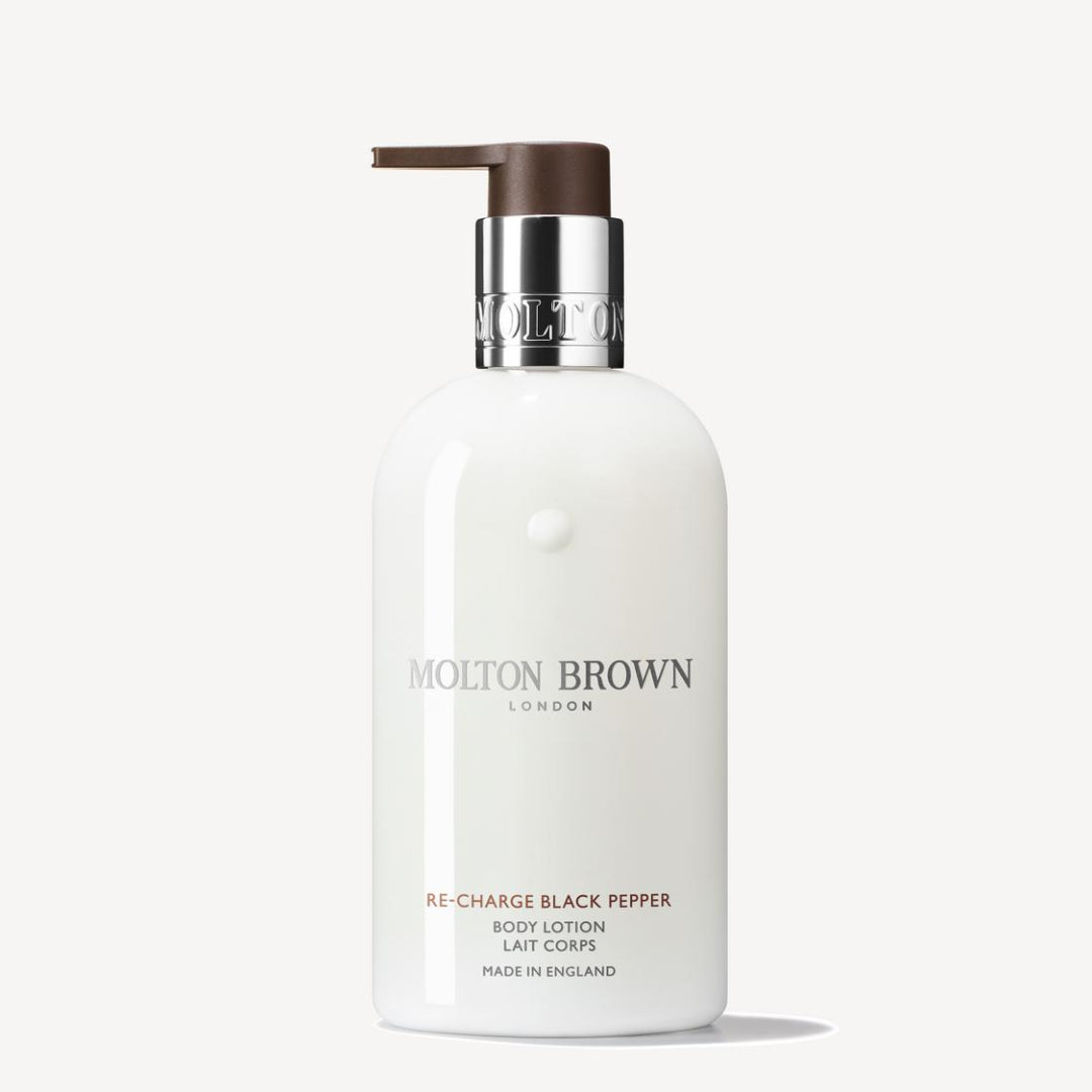 Molton Brown body lotion bottle on a white background