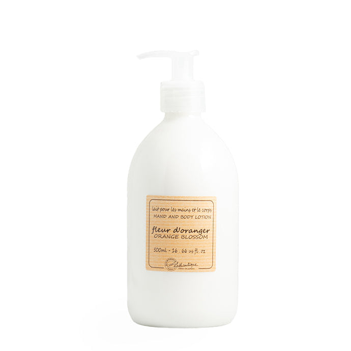 A pump bottle of Authentique Orange Blossom Hand & Body Lotion against a white background.