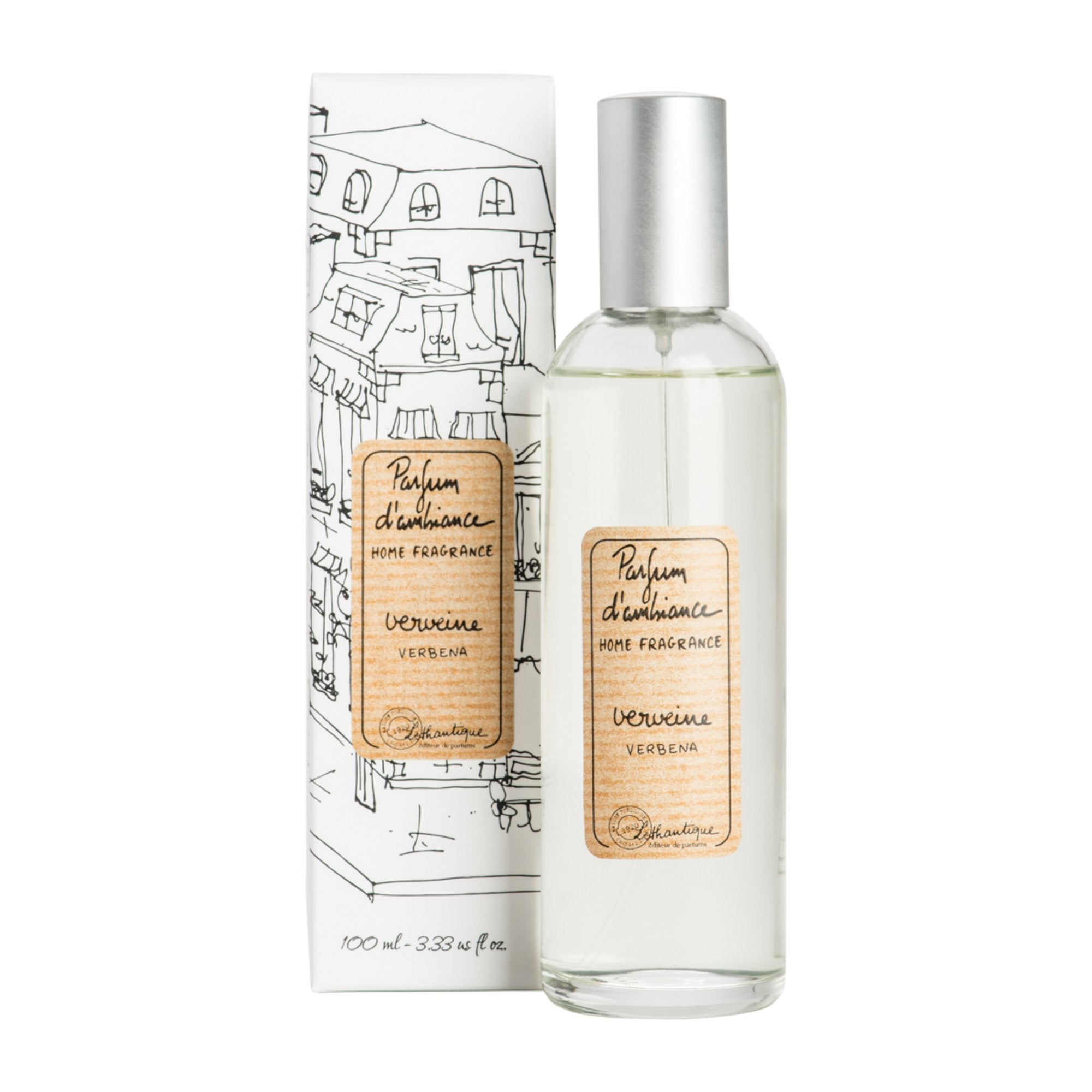 A clear glass room spray bottle with a label next to its packaging featuring a drawing of a house.