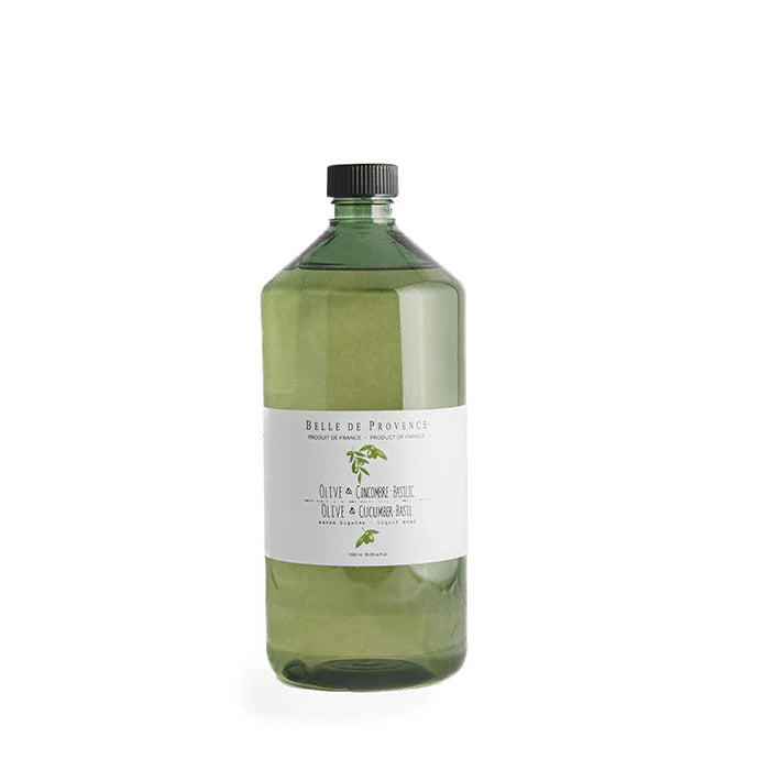 A clear bottle of Belle de Provence liquid soap with a label that includes the product name and a picture of olive leaves.