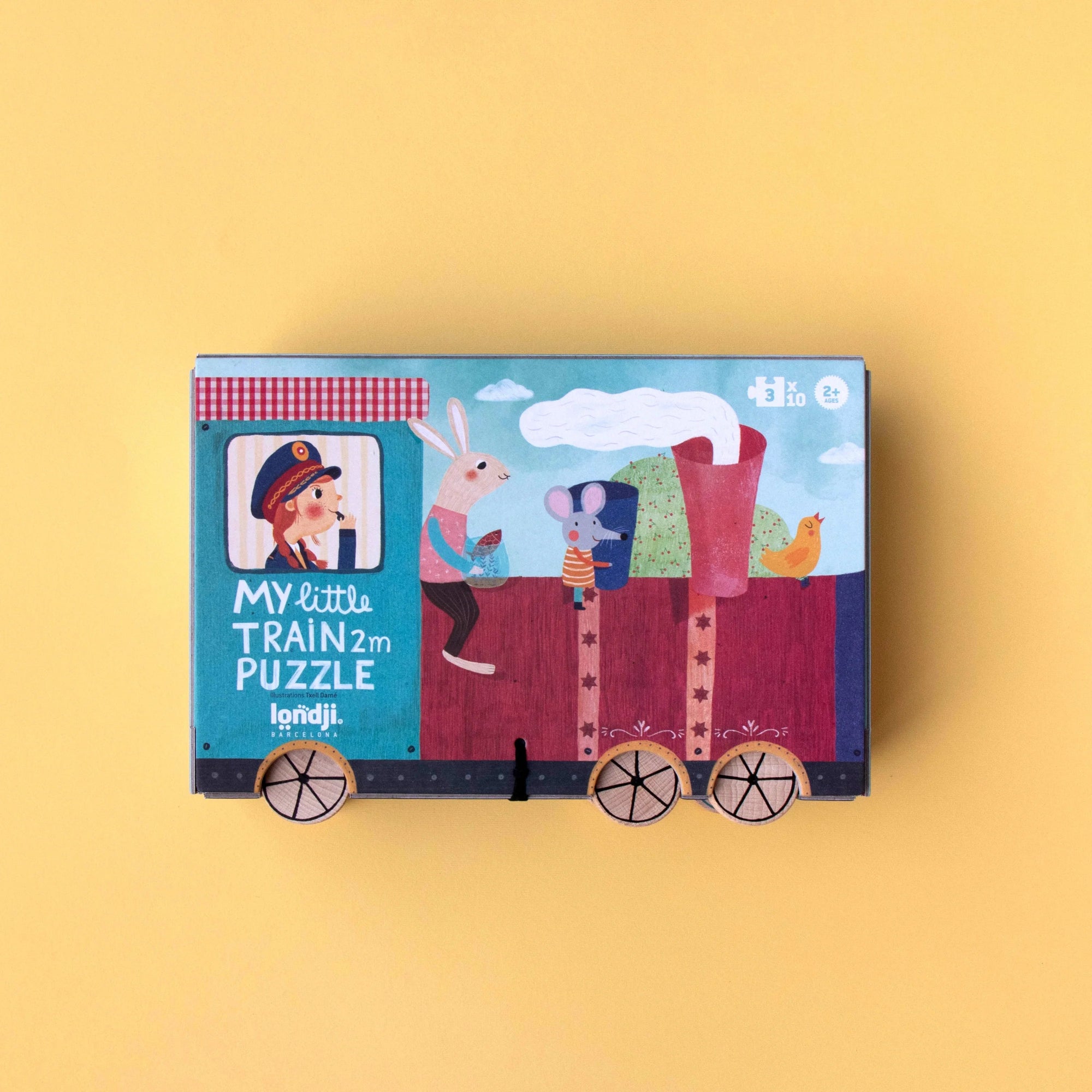 Children's puzzle box with train design on a yellow background