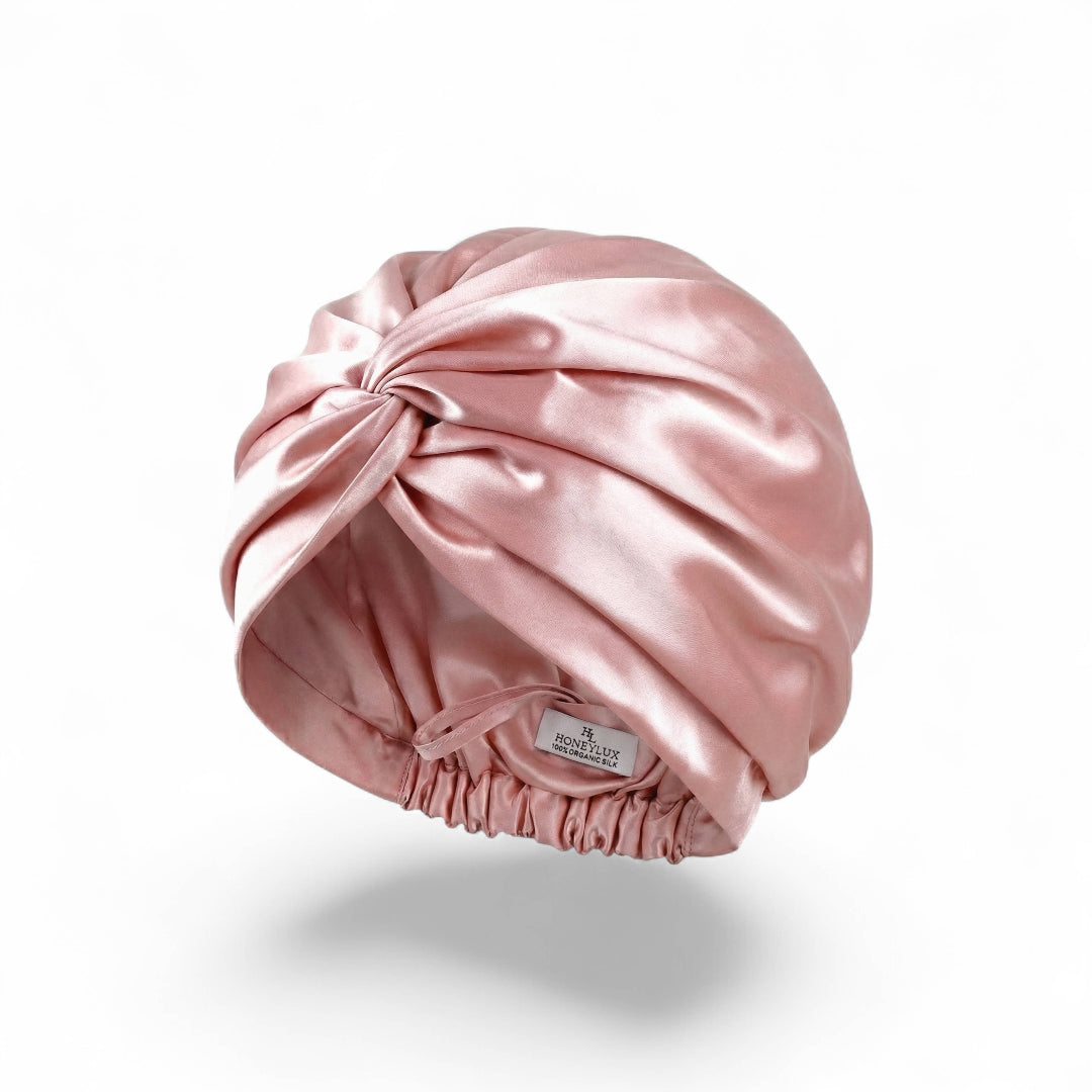 Pink Silk hair turban on a white background