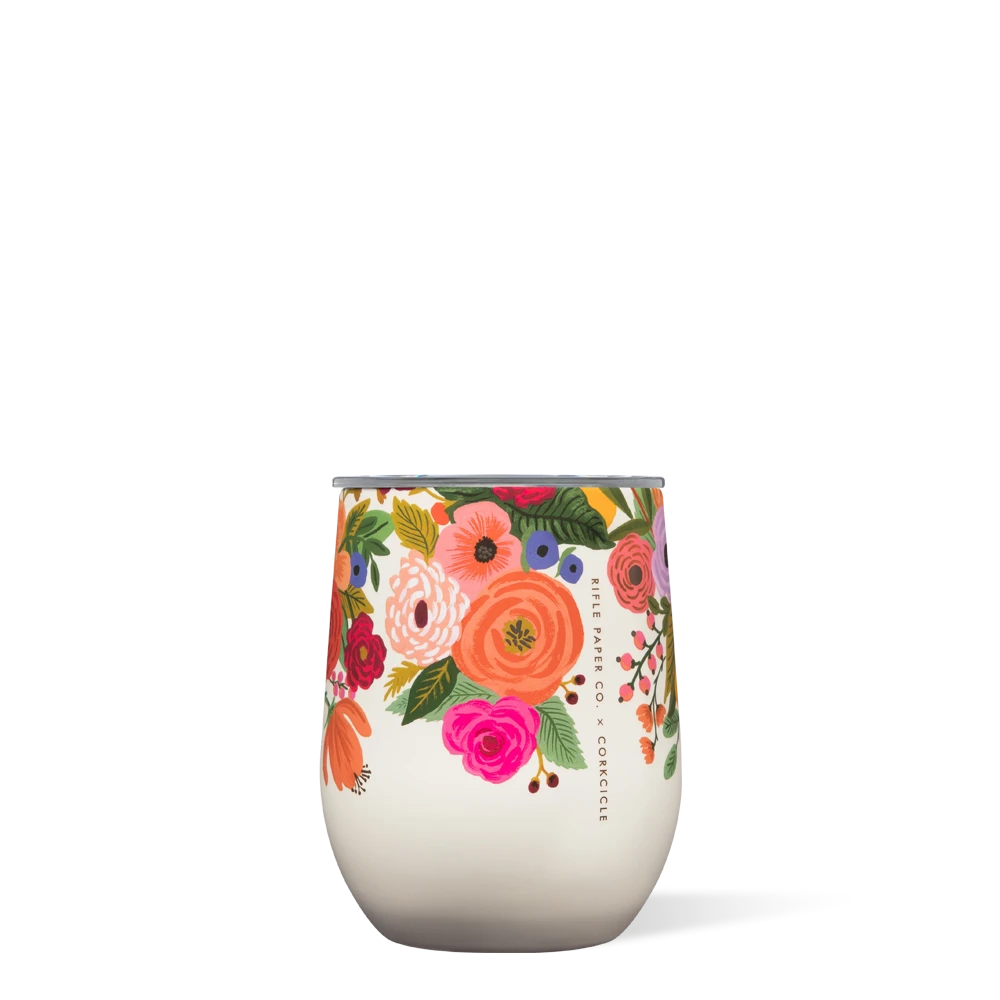 A cream-colored stemless cup with a floral pattern from Rifle Paper Co.