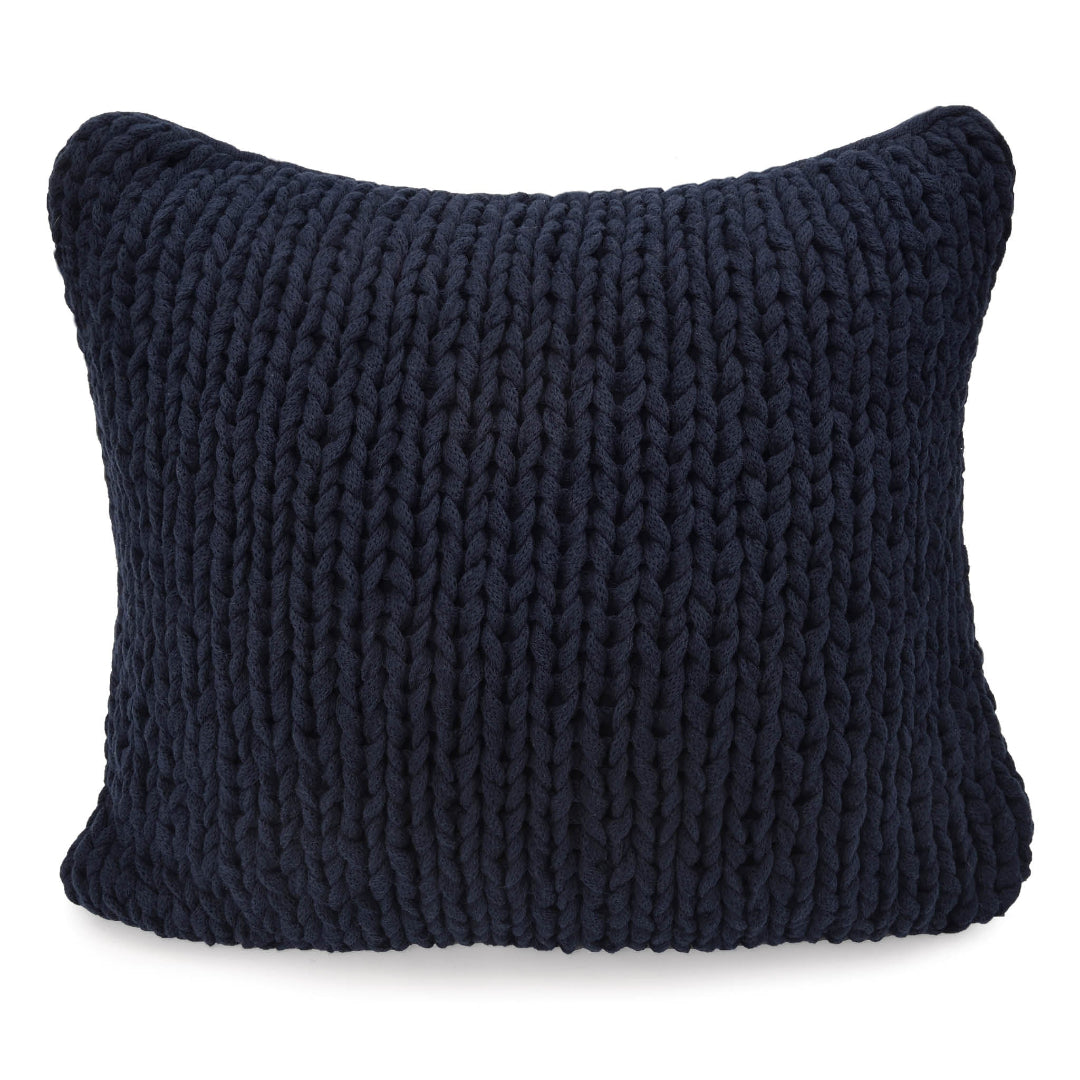 Two navy blue, hand-knit pillows of different sizes with a visible texture.