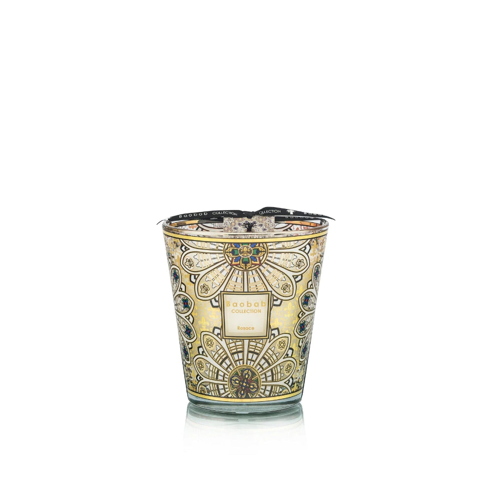 Decorative candle with intricate design on a white background