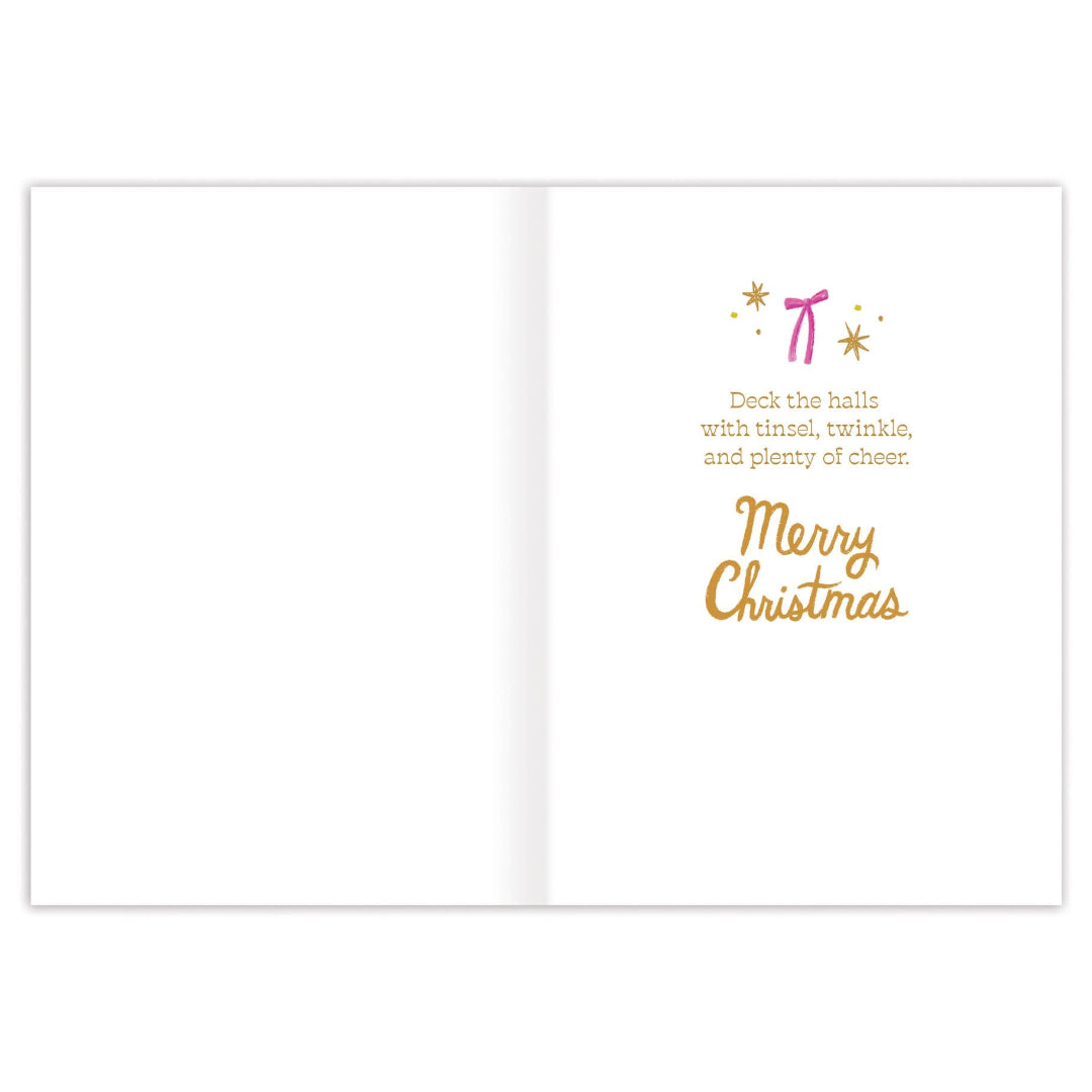 Christmas card with gold text "Deck the halls with tinsel, twinkle, and plenty of cheer" on a white background
