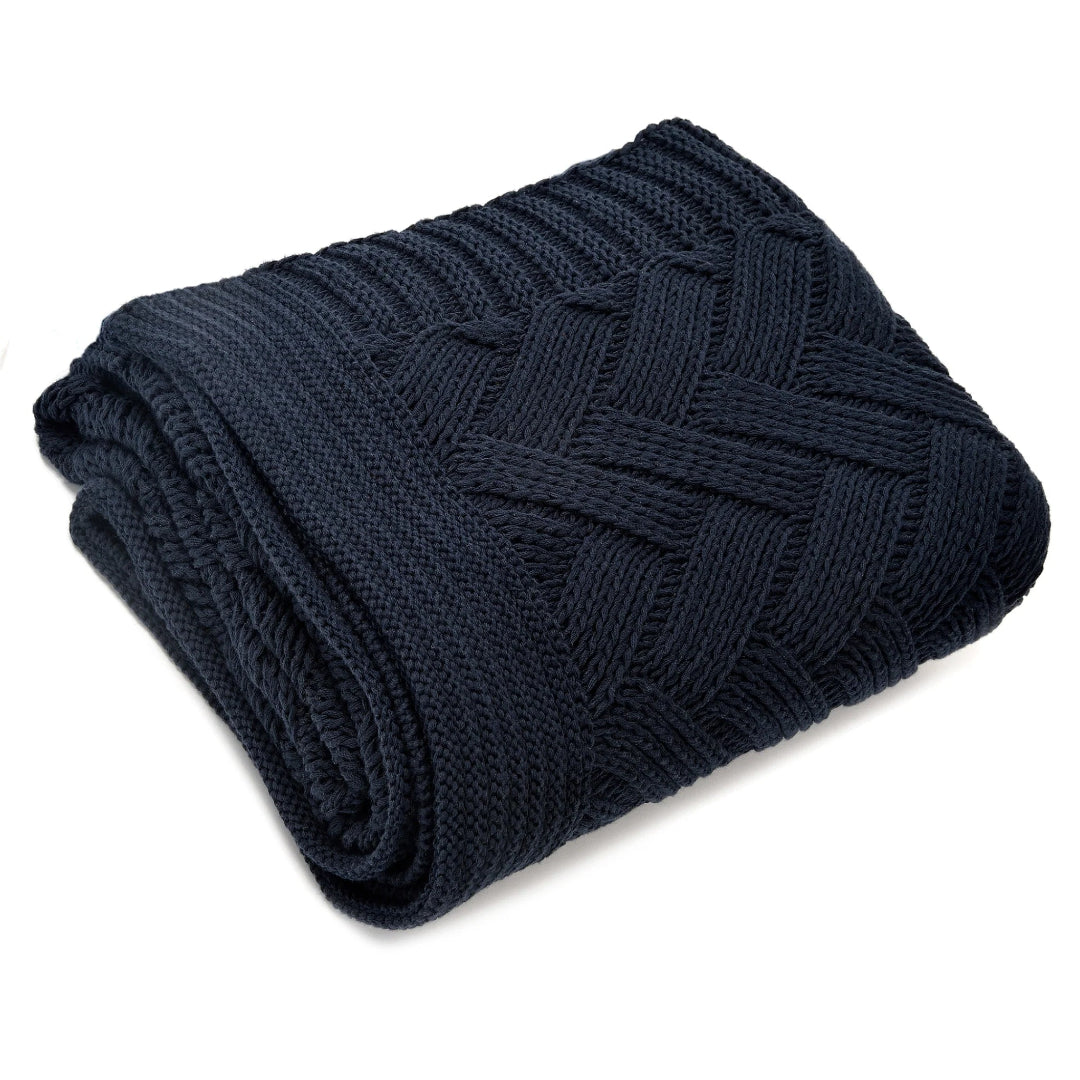 Navy throw blanket with a herringbone pattern and solid striped border, folded neatly.
