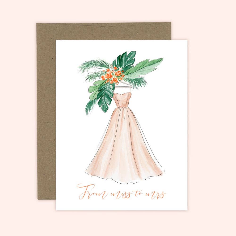 A greeting card with a hand-illustrated design of a bridal dress accompanied by a bouquet of jungle florals and large exotic leaves. The text on the card reads 'From miss to mrs.