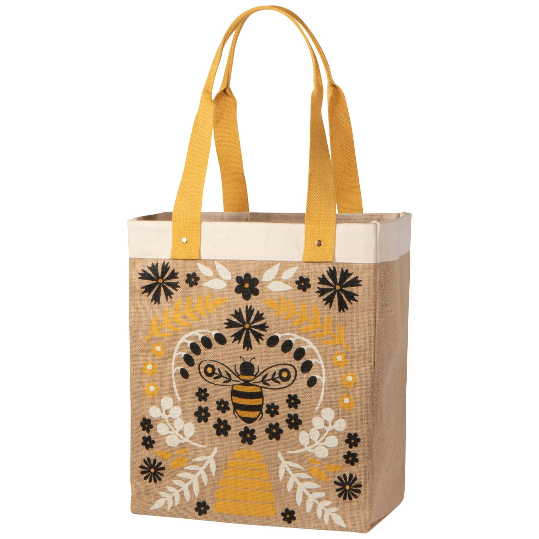 Tote bag with bee and floral design on a white background