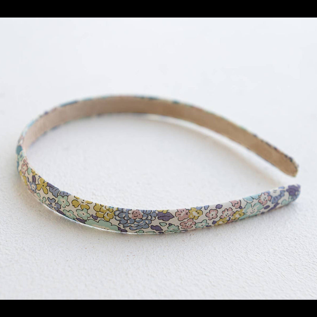 Floral patterned headband on a white background