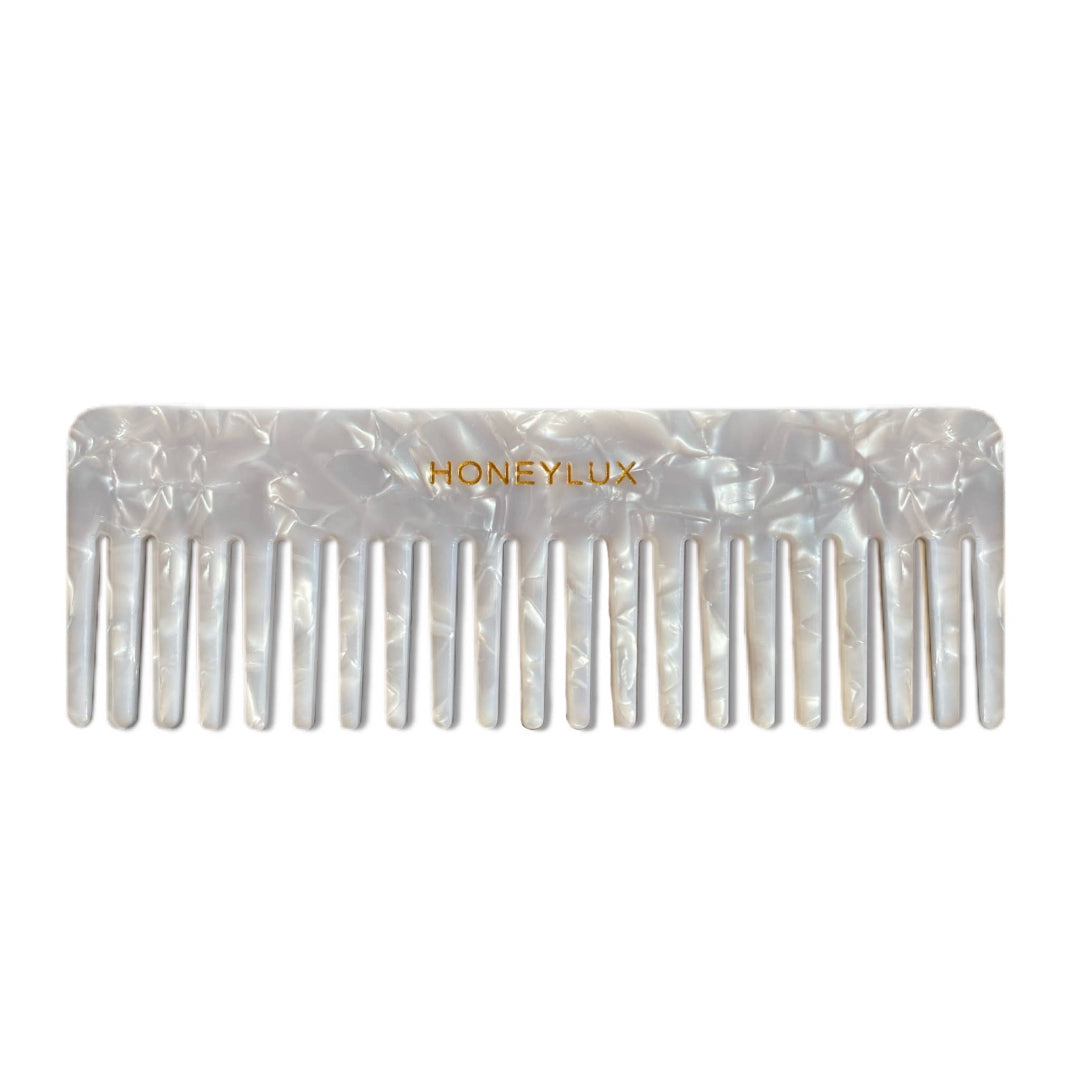 Pearl comb with 'Honeylux' branding on a white background