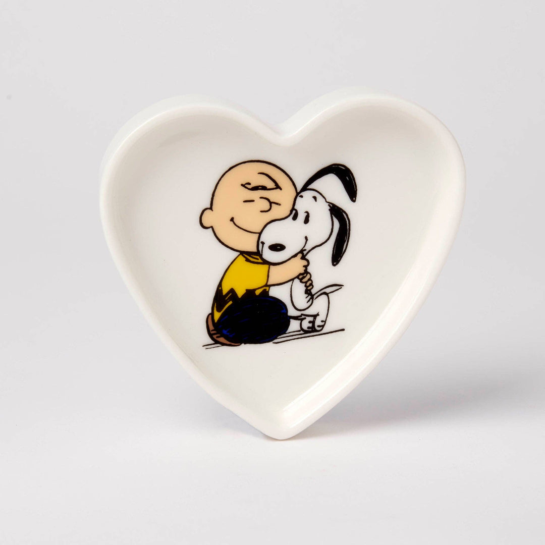 Heart-shaped plate with cartoon characters on a light gray background