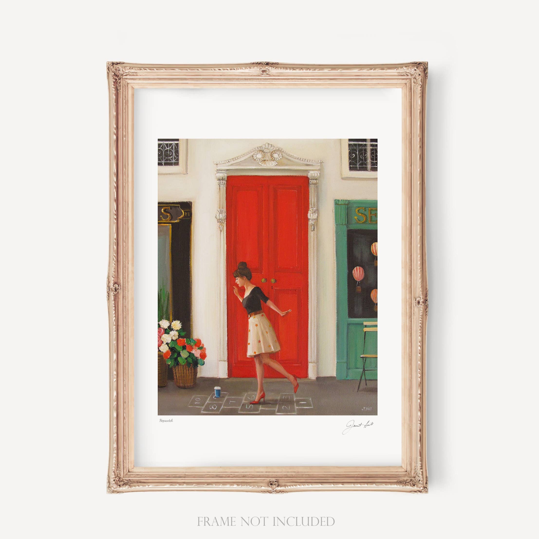 A framed art print featuring a woman playing hopscotch on a red door, with a classic design and a subtle color palette.
