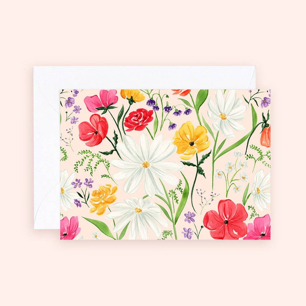A mini greeting card with a floral enclosure showing various colored flowers and foliage on a white background, paired with a white envelope.