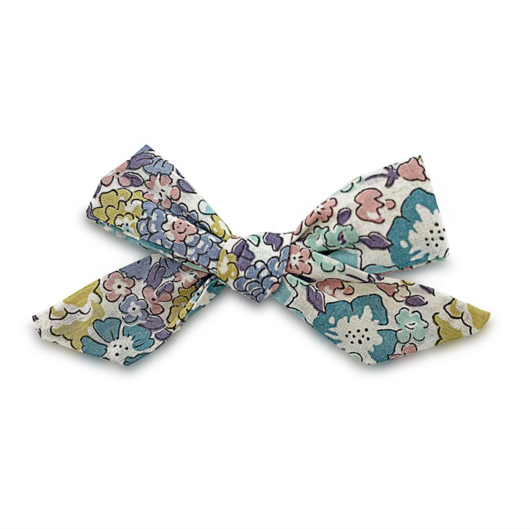 Floral patterned bow on a white background