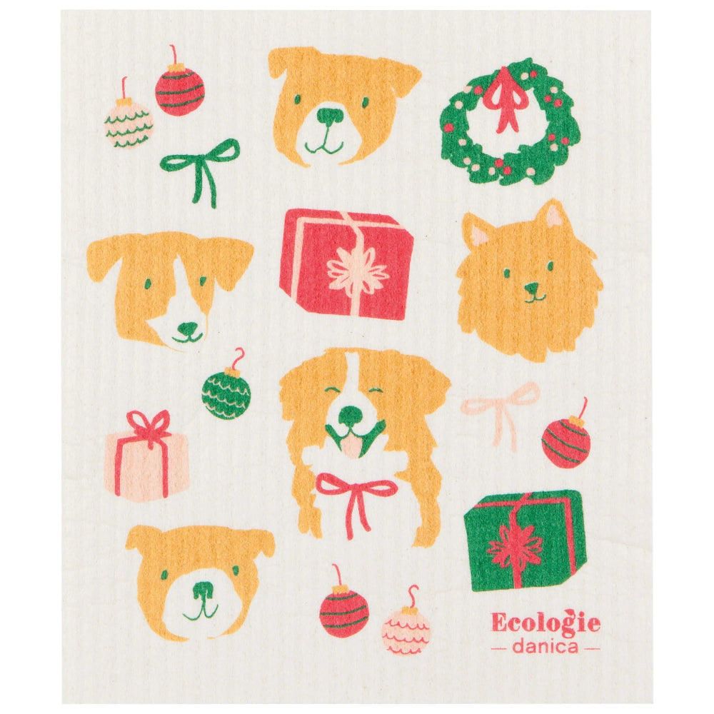 Decorative dishcloth with Christmas-themed designs including dogs, presents, and ornaments on a white background.