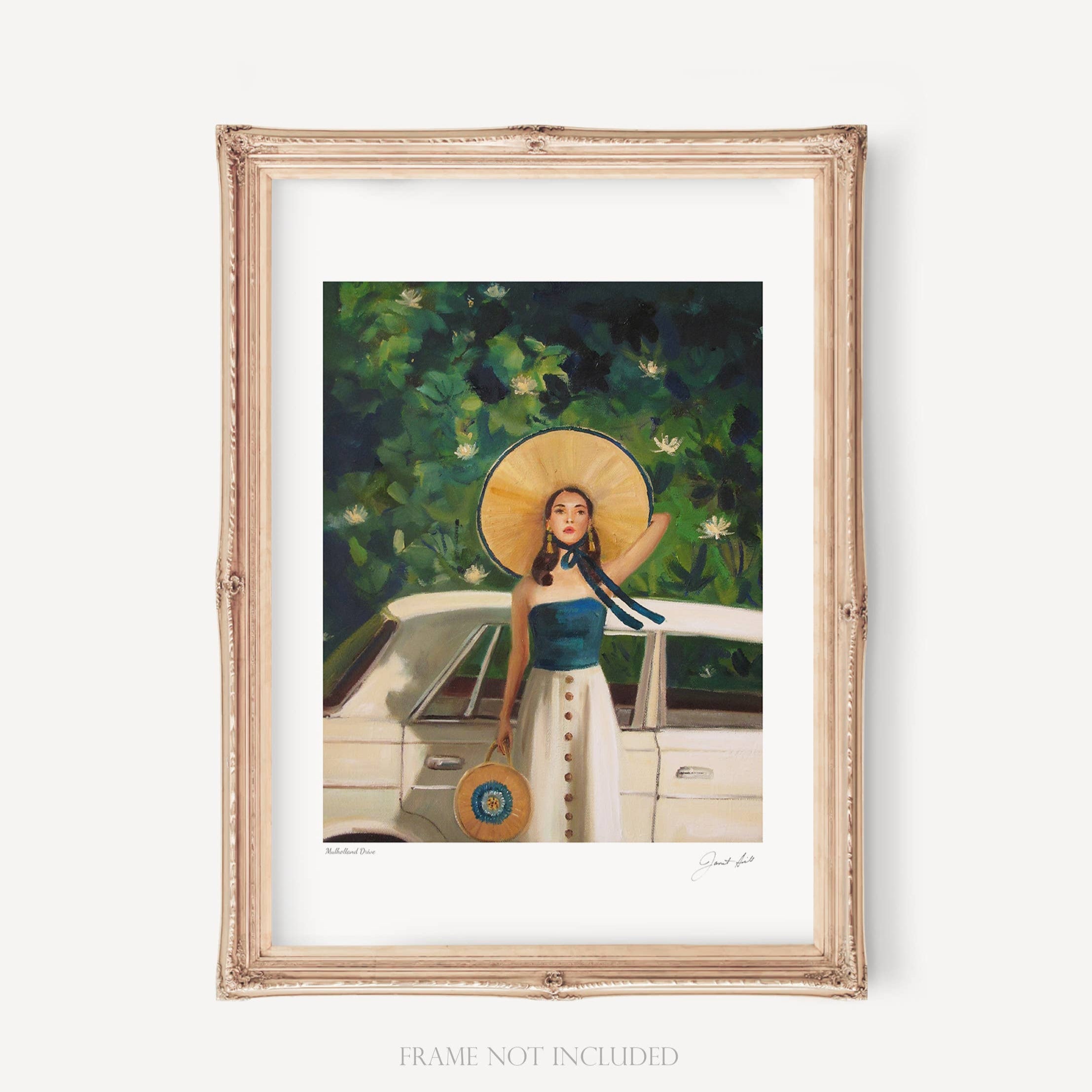 A framed art print featuring a woman with a hat and a blue dress, sitting beside a car, with a forest background. The frame is white and the artwork is signed by the artist.