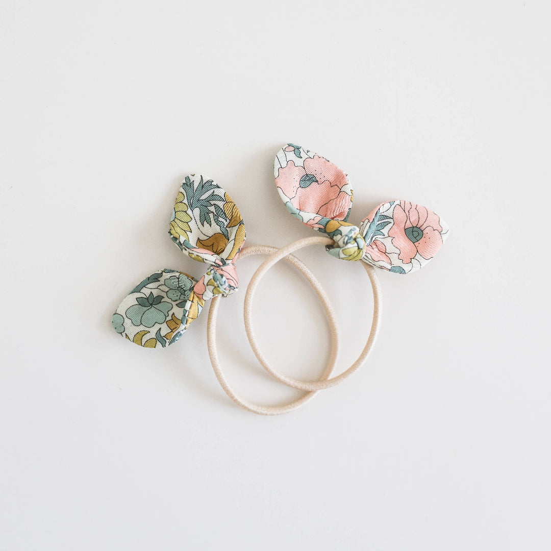 Floral headbands with bunny ears on a light background